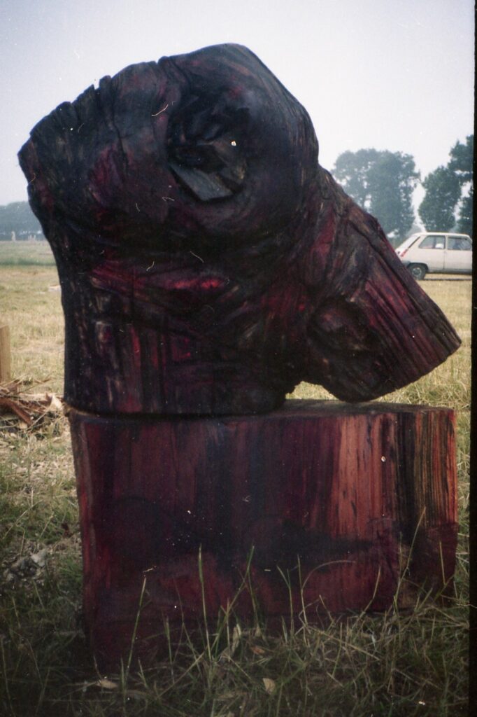 Dark red and black carved outdoor sculpture