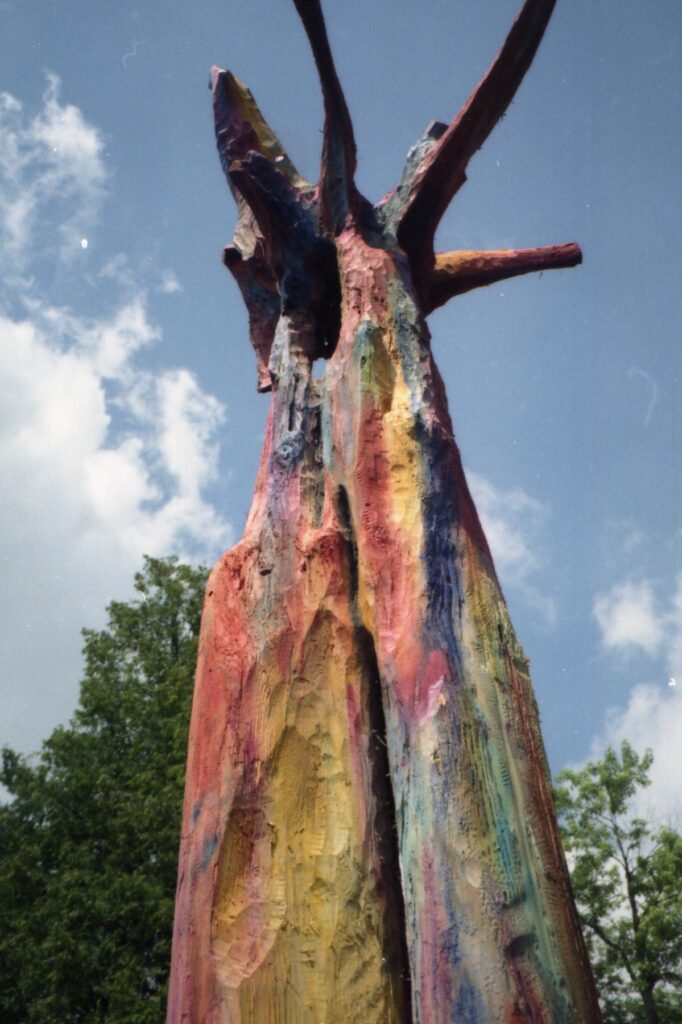 Close view of a colorful forked wooden sculpture
